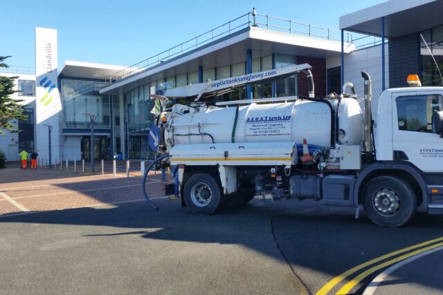 AE & AT Lewis lorry emptying tanks outside Coleg Llandrillo